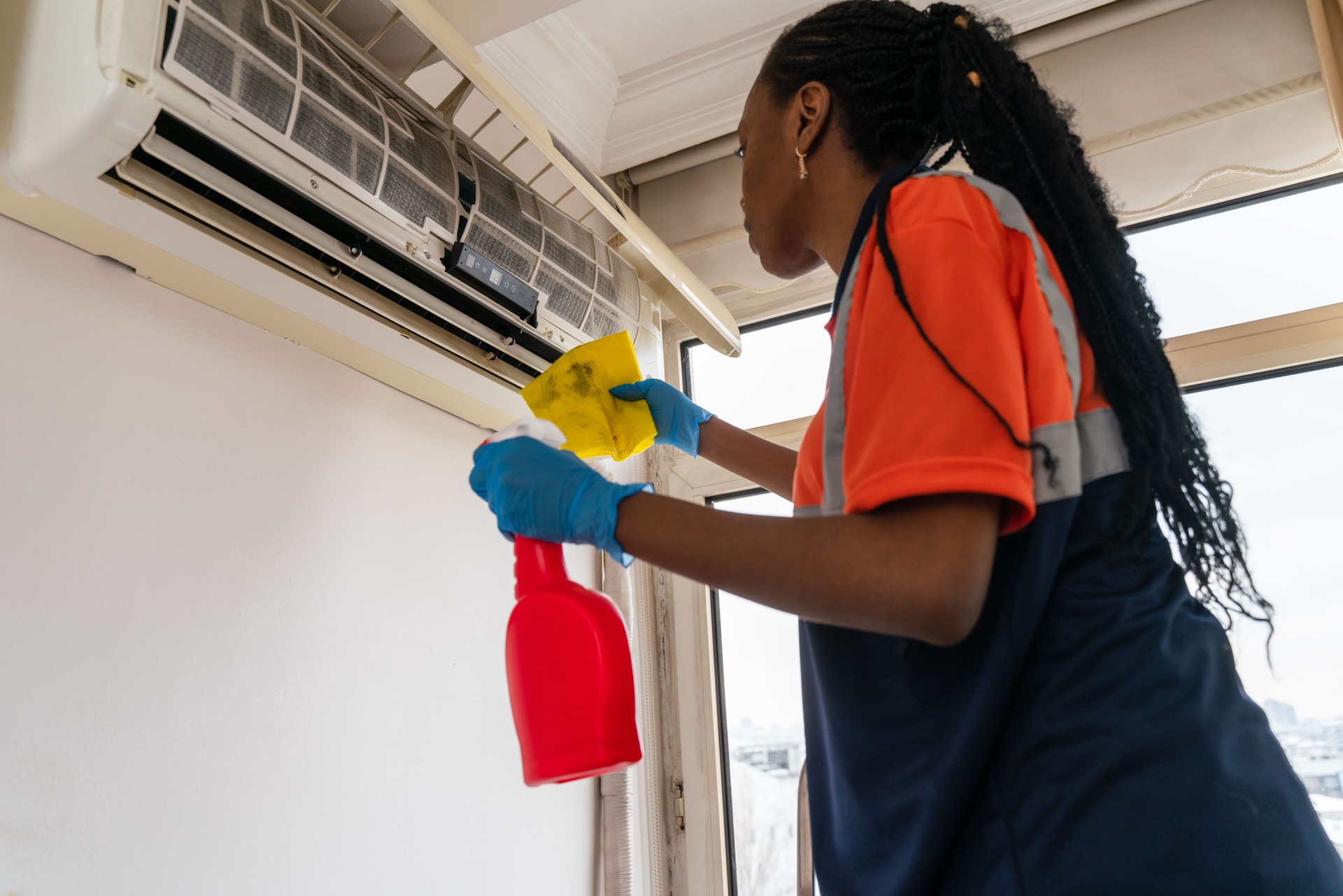 black female  Cleaning Air Conditioning System